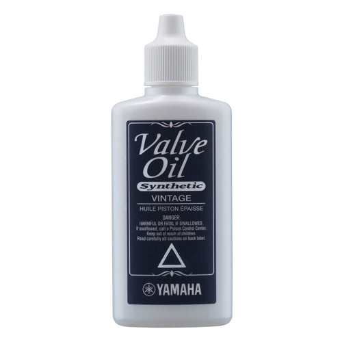 A bottle of Yamaha AVO-V Synthetic Valve Oil with a label indicating it is designed for vintage brass instruments.
